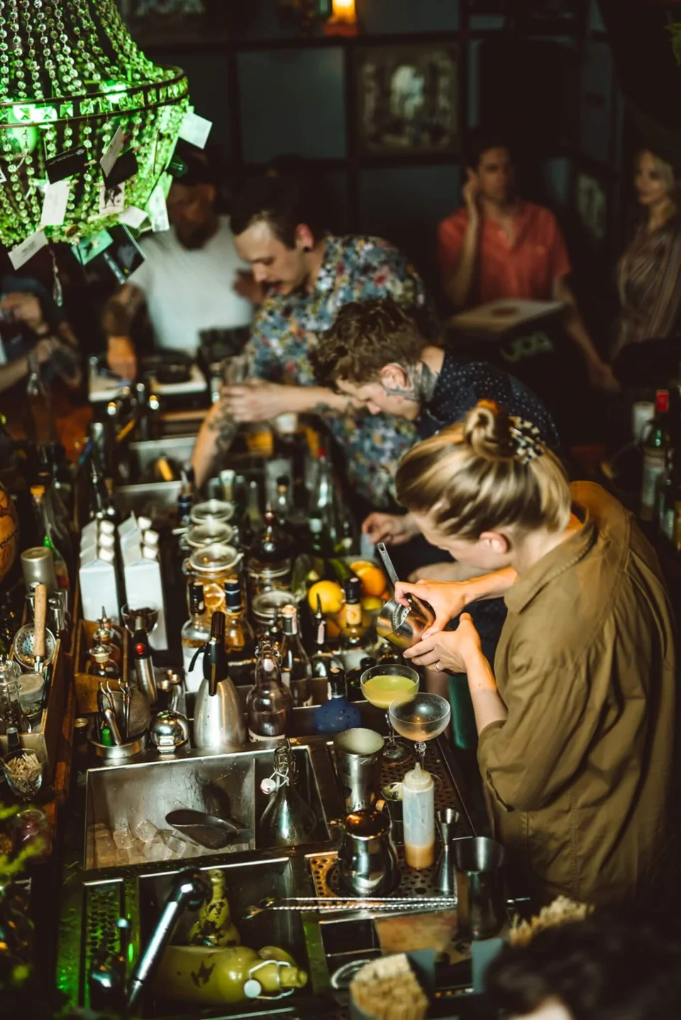 Bartenders preparing cocktails at Alchemikas in an archive photograph.