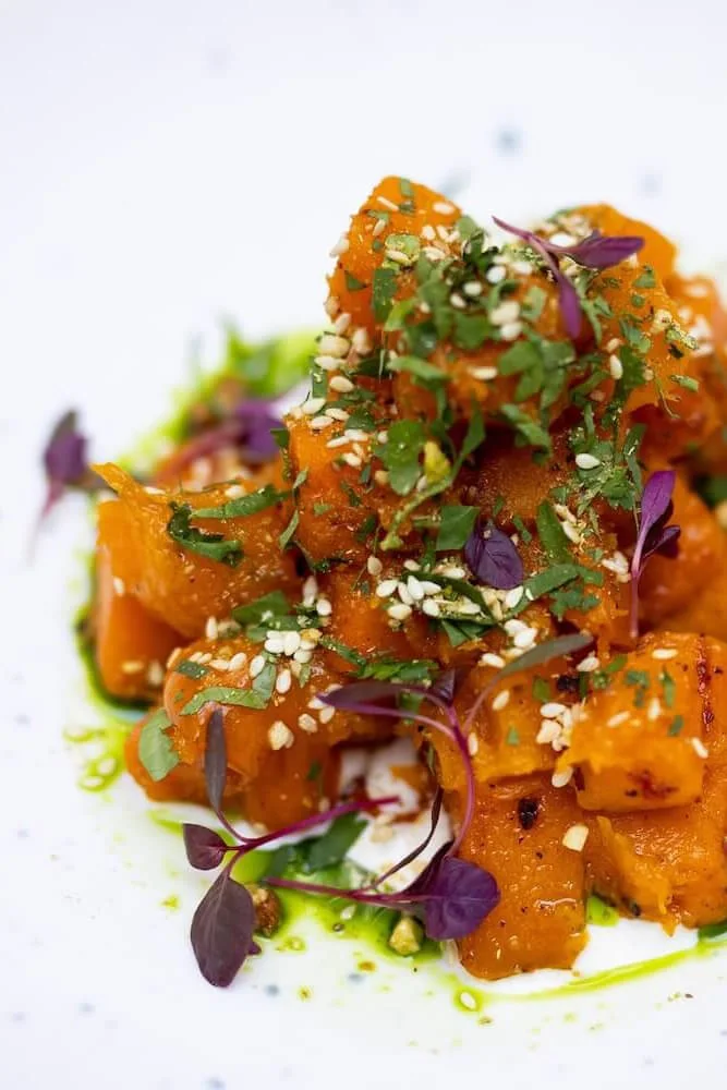 Roasted pumpkin with colourful garnishes at Augustin.