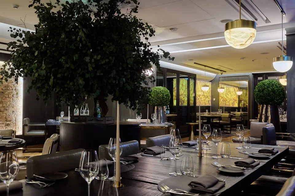 Tables set for dinner in the PACAI restaurant interior.
