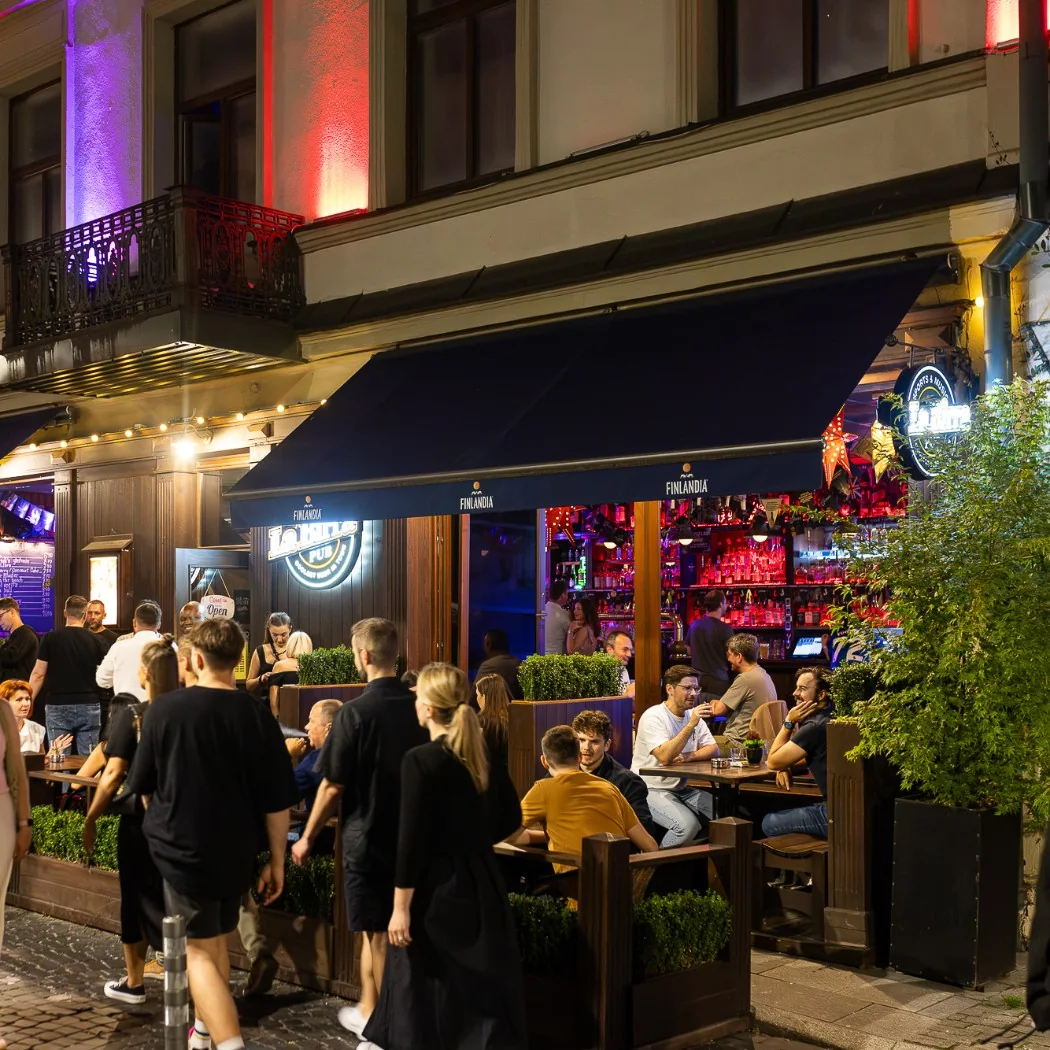 Busy bar terrace on Vilniaus Street in Vilnius at night