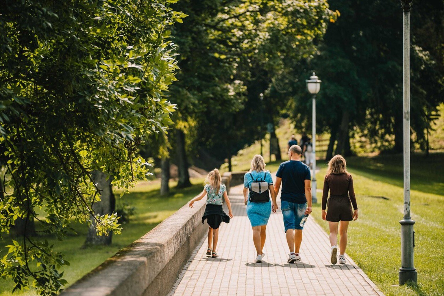 Family walking through green Birštonas