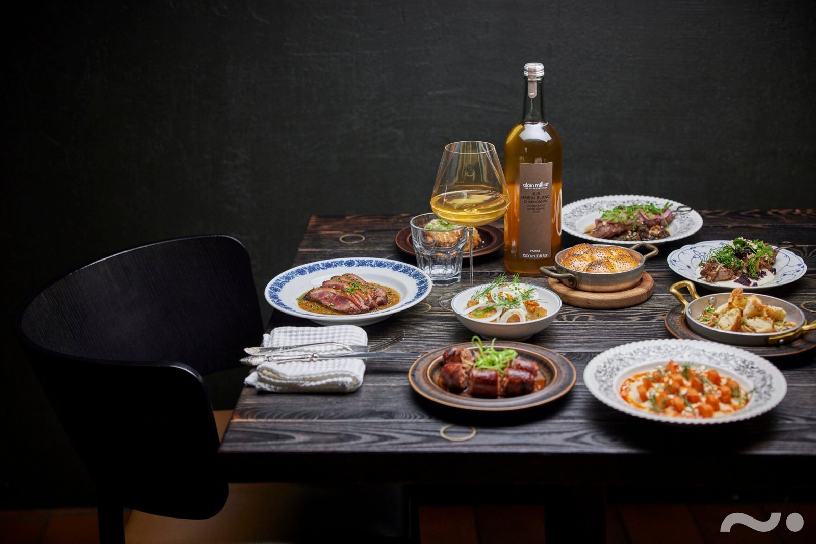 MOMO Grill Klaipėda table filled with grilled dishes