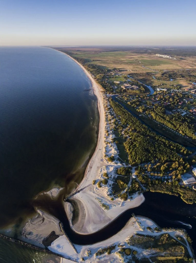 Aerial view of Šventoji coastline, river mouth and Baltic Sea